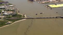 Barge collides with Texas bridge pouring oil into river