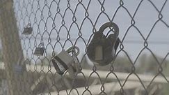 Discover security in unity! Padlocks cling to chain-link fence, symbolizing strength in numbers. Perfect for concepts of safety, protection, and solidarity. "