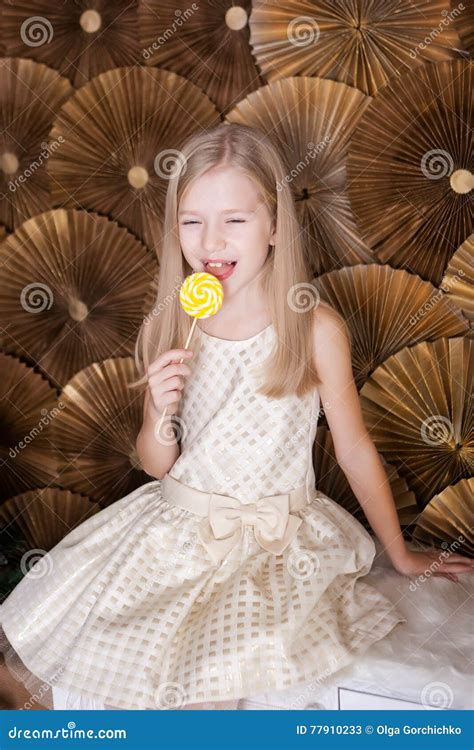 Cute girl with a lollypop stock image. Image of christmastime - 77910233