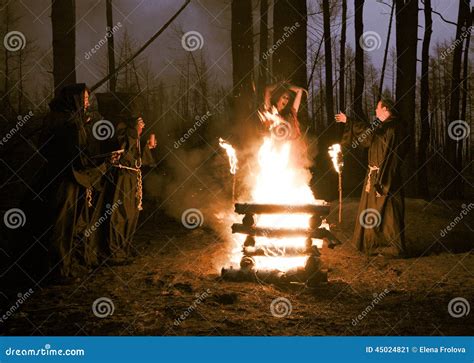 Halloween. Men in Black Clothes, Burn the Witch at the Stake at Stock ...
