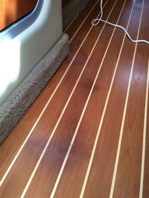 Factory teak floor — Rinker Boat Company