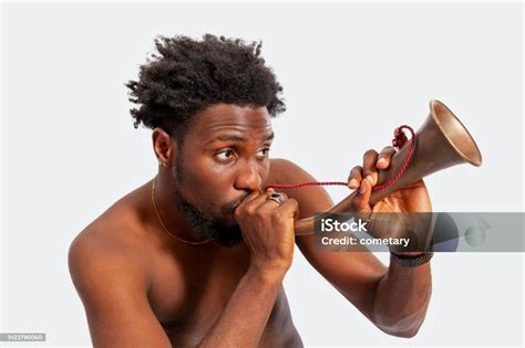 Portrait Of Happy Men Playing Bugle Stock Photo - Download Image Now ...