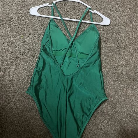 Green one-piece bathing suit. Never worn in... - Depop