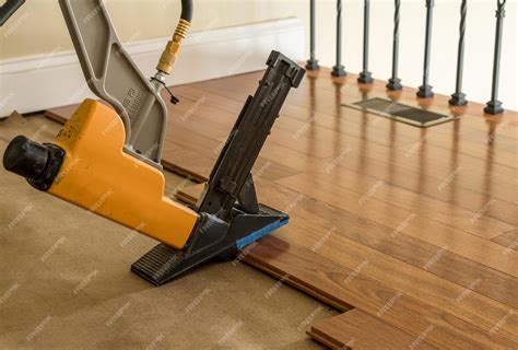 Premium Photo | Nailing gun ready to staple sections of brazilian ...