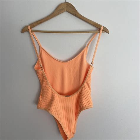 low back orange one piece swimsuit only worn once - Depop