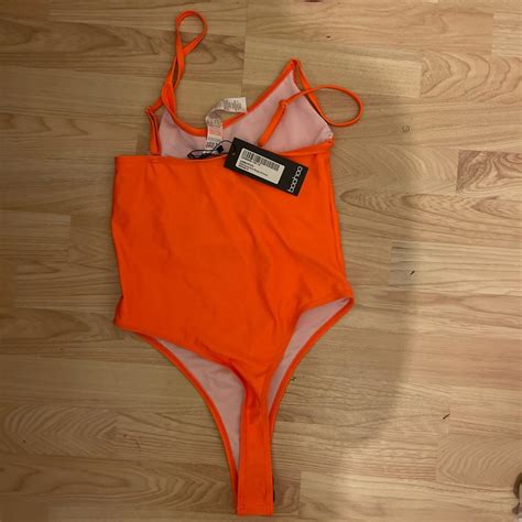 Neon orange swimming costume size 10 brand new - Depop