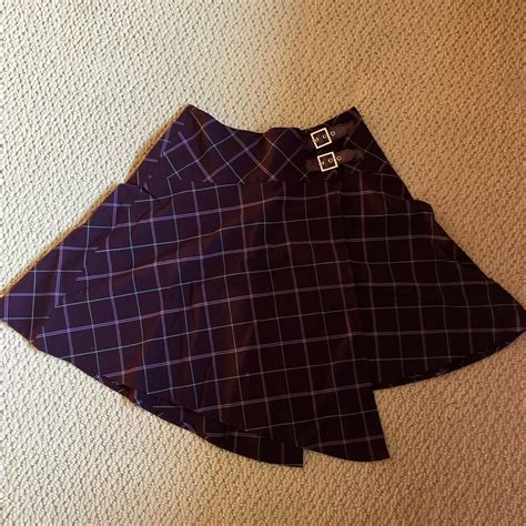 size 0 purple plaid skirt barely worn, no noticeable... - Depop