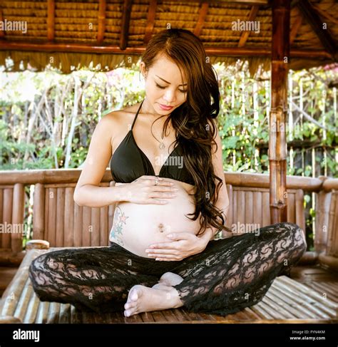 Beautiful pregnant Asian woman Stock Photo - Alamy