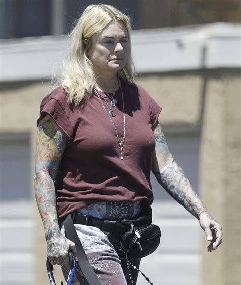 'Baywatch' alum Erika Eleniak shows off tattoos in rare outing