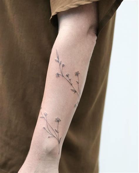 Wrap Around Arm Tattoo