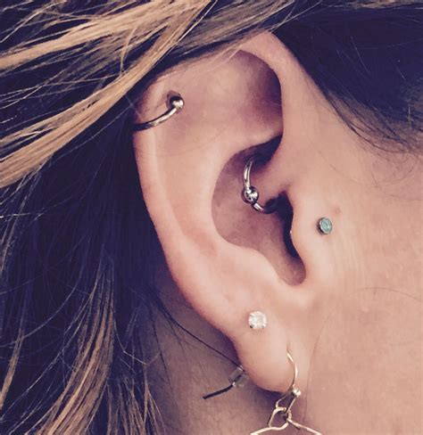 Daith, tragus and helix piercing. | Ear piercings, Ear piercings tragus ...