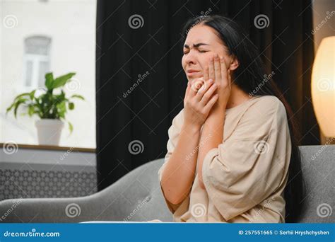 Woman with Severe Toothache Touching Her Swollen Cheek. Young Girl Feeling Discomfort after ...