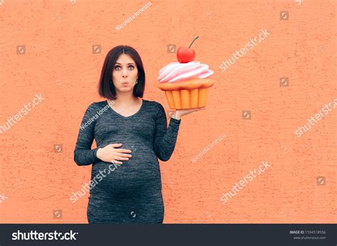 Pregnant Woman Craving Sweets Holding Huge Stock Photo 1594518556 ...