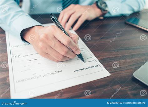 New Employees To Fill Out Job Application Documents. Stock Image ...