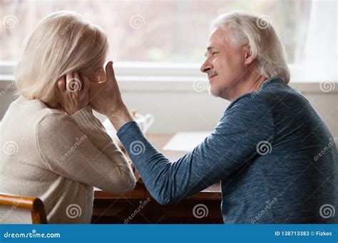 See related image detail. Side View Aged Husband Touching Stroking Face of Beloved Wife Stock ...