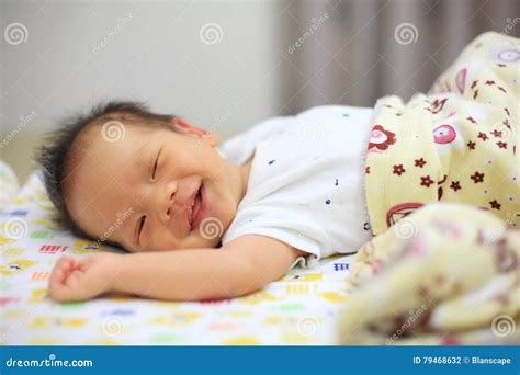 Newborn Baby Sleep and Smile Stock Photo - Image of face, cute: 79468632