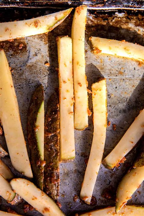 Garlic Parmesan French Fries Dressed in Caesar Dressing. - Half Baked ...