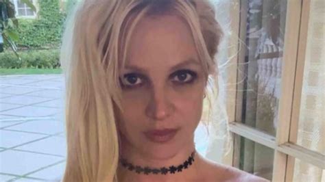 Britney Spears goes topless in nothing but a necklace as she pulls ...