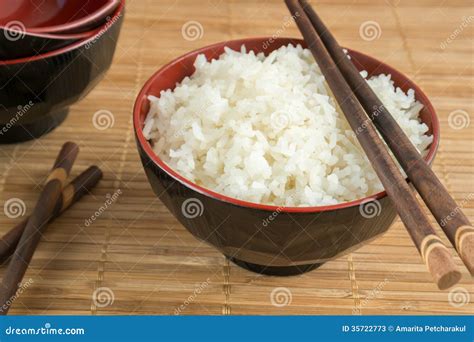 White Steamed Rice In A Bowl With Chopsticks Royalty-Free Stock Photo ...