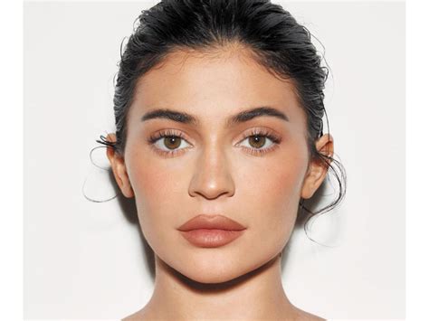 Kylie Jenner flaunts her gorgeous figure in a skintight nude dress as ...