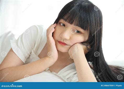 Beautiful Young Asian Woman Sleeping on Bed Relaxing in the Morning Light with White Room Stock ...