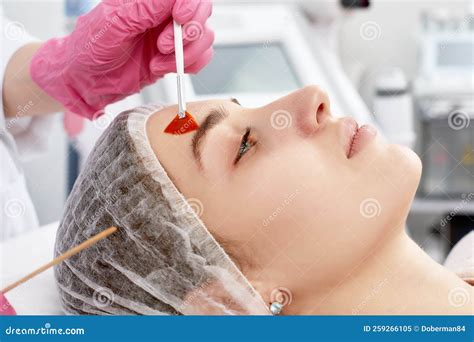 Procedure of Photoepilation in the Beauty Salon. Young Woman Receiving Epilation Laser Treatment ...