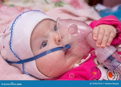 Treatment with an Nebulizer,baby Inhales through the Inhaler Medicine ...