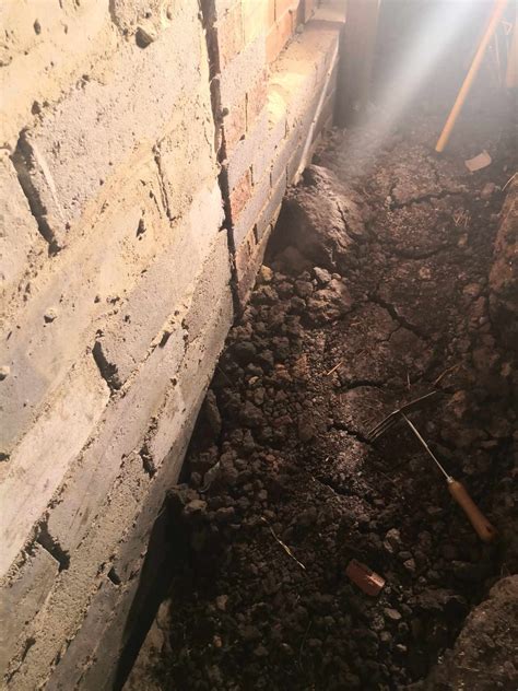 Best safest way to clear dirt from under house that is pushing against ...