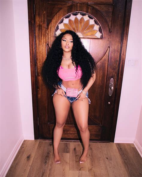 Nicki Minaj reveals 'new boobs' after teasing breast reduction surgery
