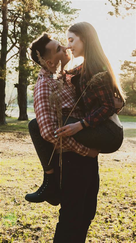 Guy Carrying Girl In Arms