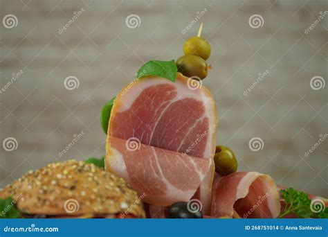 Traditional Italian Smoked Dry Ham Close-up Composition with Basil and ...