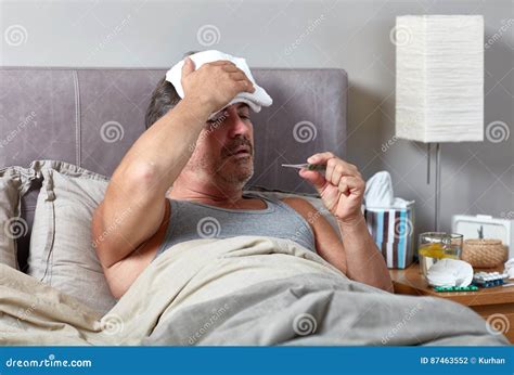 Sick man in bed stock photo. Image of caucasian, indoors - 87463552