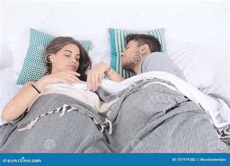 Couple sleeping in bed. stock photo. Image of lifestyle - 101979382