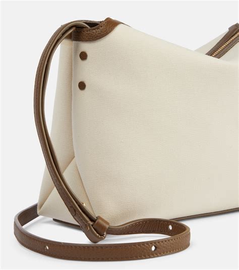 Lina leather-trimmed canvas crossbody bag in white - Khaite | Mytheresa