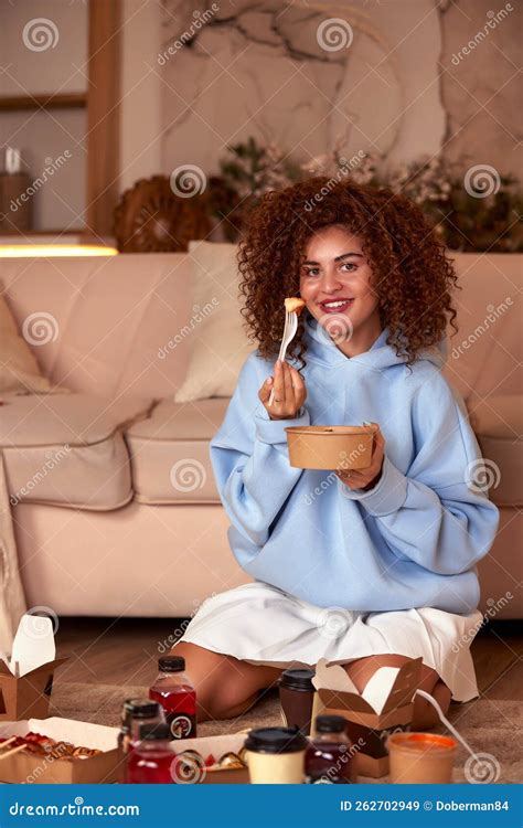 Young Woman Eating Sushi at Home. Home Food Delivery Concept. Japan ...