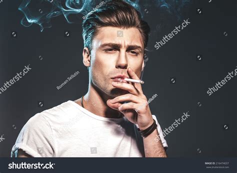Handsome Young Man Smoking Cigarette Stock Photo 216474037 : Shutterstock