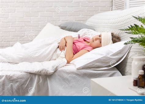 Sick Little Girl Lying in Bed with Thermometer Stock Photo - Image of ...
