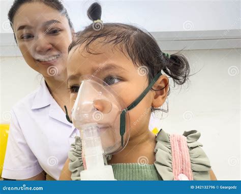 Doctor Applying Medicine Inhalation Treatment on a Toddler Baby Girl ...