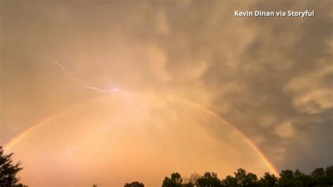 Lightning and rainbow appear to collide in breathtaking Ohio video
