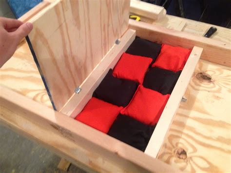 Bag storage underneath the Cincinnati Bengal corn hole board. Check www ...