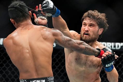 Islam Makhachev wins 170-pound title, ties UFC record with 16th ...