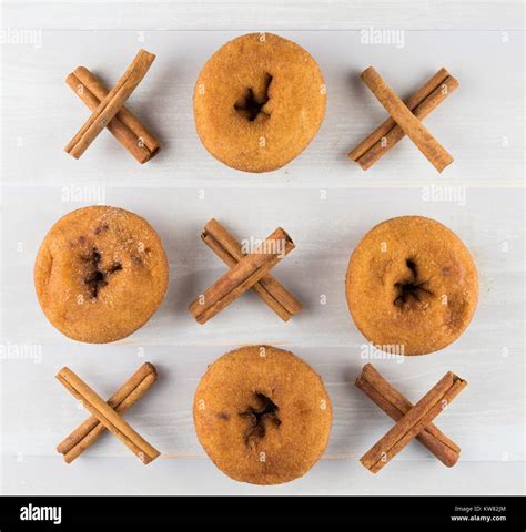Tic Tac Toe with Donuts and Cinnamon Sticks Tied in Xs Stock Photo - Alamy