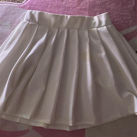 White golf skirt, small stains. Size small-medium... - Depop