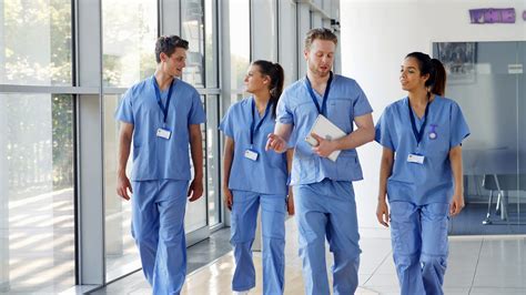 Medical Interns Wearing Scrubs Walk Towards Stock Footage SBV-323485543 - Storyblocks