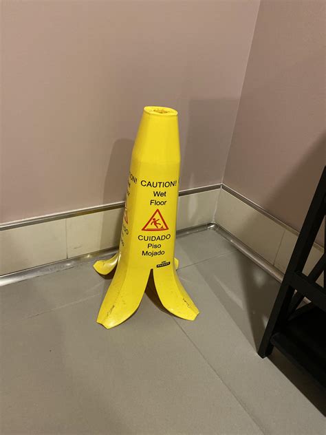 This wet floor sign that looks like a banana peel : r/mildlyinteresting