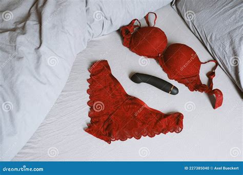 Red Lingerie Set and Vibrator on Bed Stock Photo - Image of adult ...