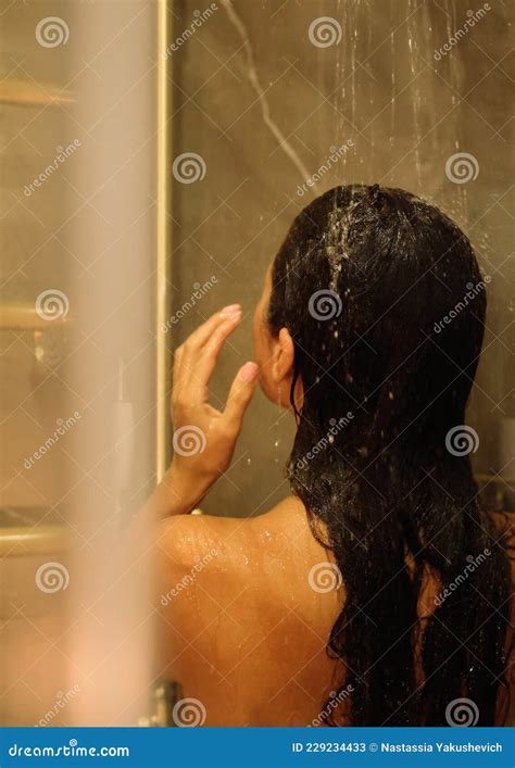 Back View of Beautiful Naked Young Woman Taking Shower in Bathroom ...