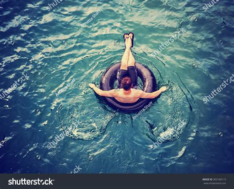 Man Floating Down River Blow Tube Stock Photo (Edit Now) 303160115