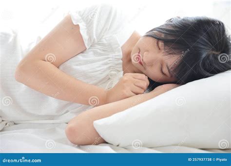 Beautiful Young Asian Woman Sleeping on Bed Relaxing in the Morning Light with White Room Stock ...