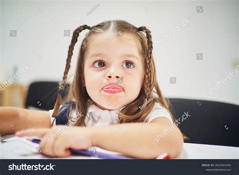 Young Little Spanish Girl Sticking Out Stock Photo 2033021435 ...